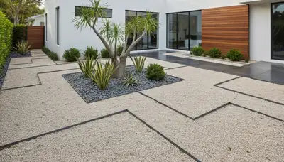 Modern pea gravel landscape with clean lines and tropical plants by Chop Chop Landscaping in Miami, FL