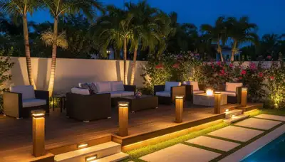 Illuminated outdoor living space with post cap and step lights by Chop Chop Landscaping in Miami, FL